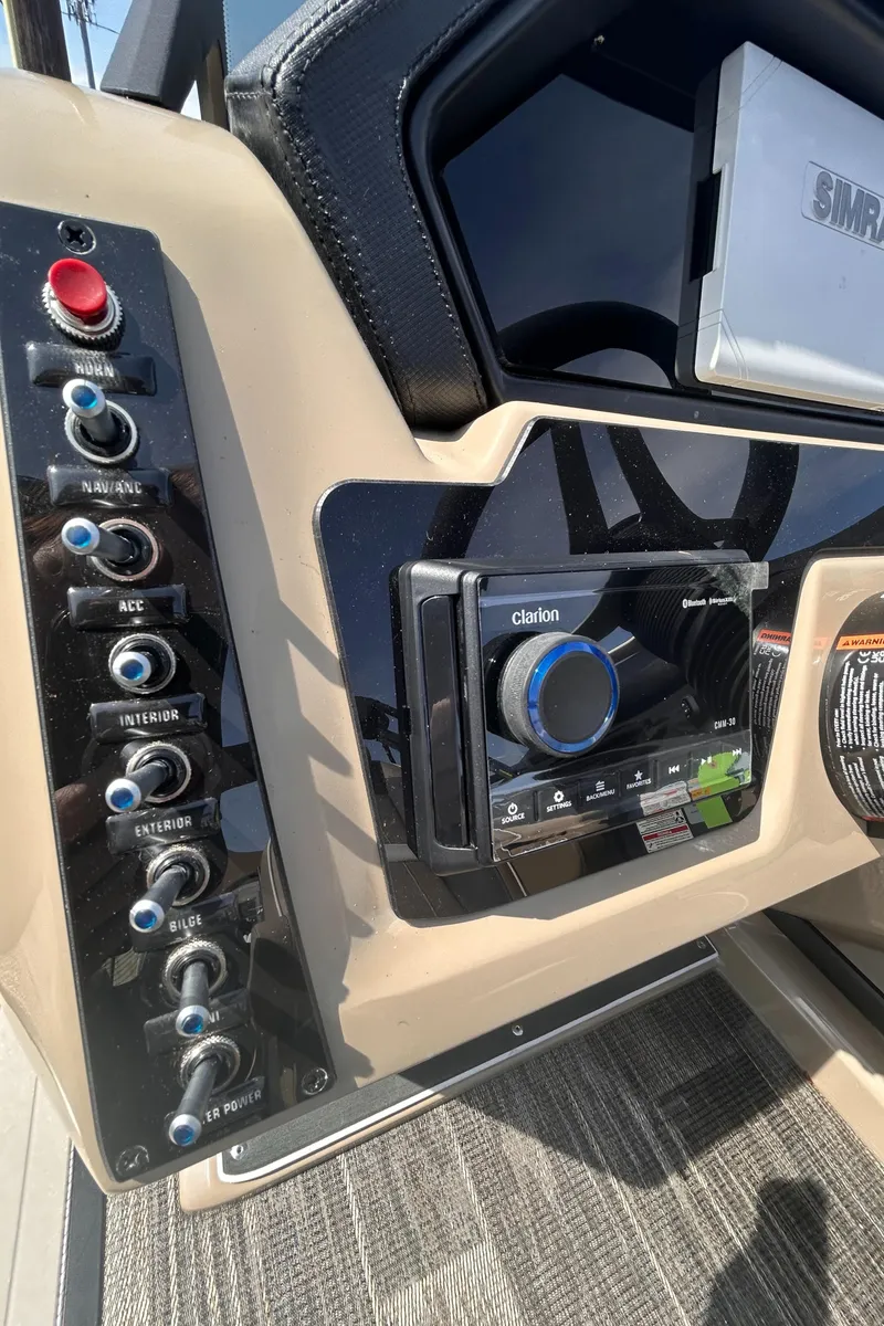 Slide: The Image of Control panel of 2025 Viaggio Lago X-U boat with audio system and switches. - 12