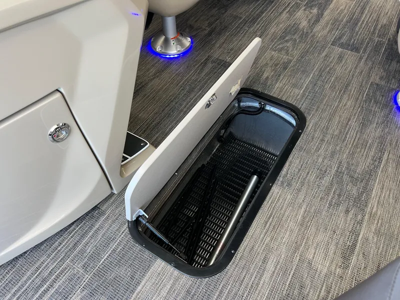 Slide: The Image of Open storage compartment in 2025 Viaggio Lago X-U boat with modern flooring and blue LED lighting. - 28