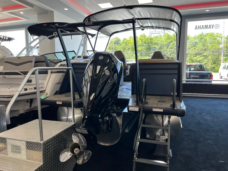 Slide: The Image of 2025 Viaggio Lago X-U pontoon boat with outboard motor in showroom. - 3