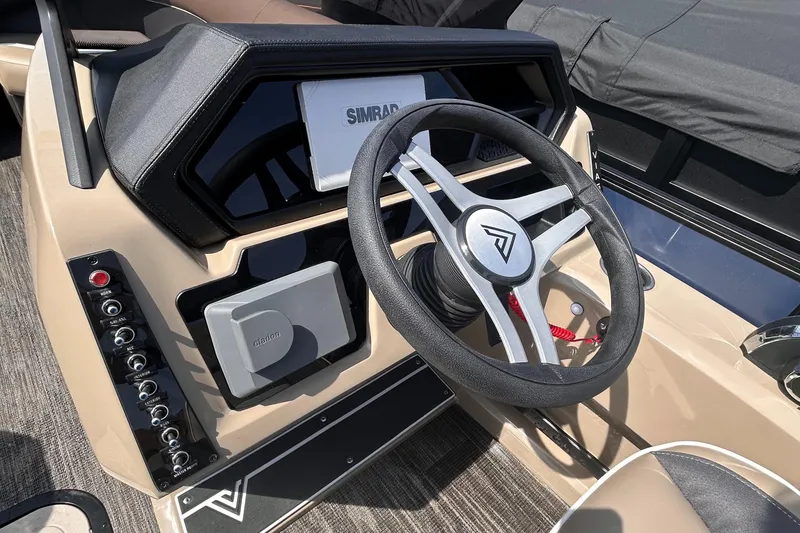 Slide: The Image of 2025 Viaggio Lago X-U boat dashboard with steering wheel and control panel. - 7