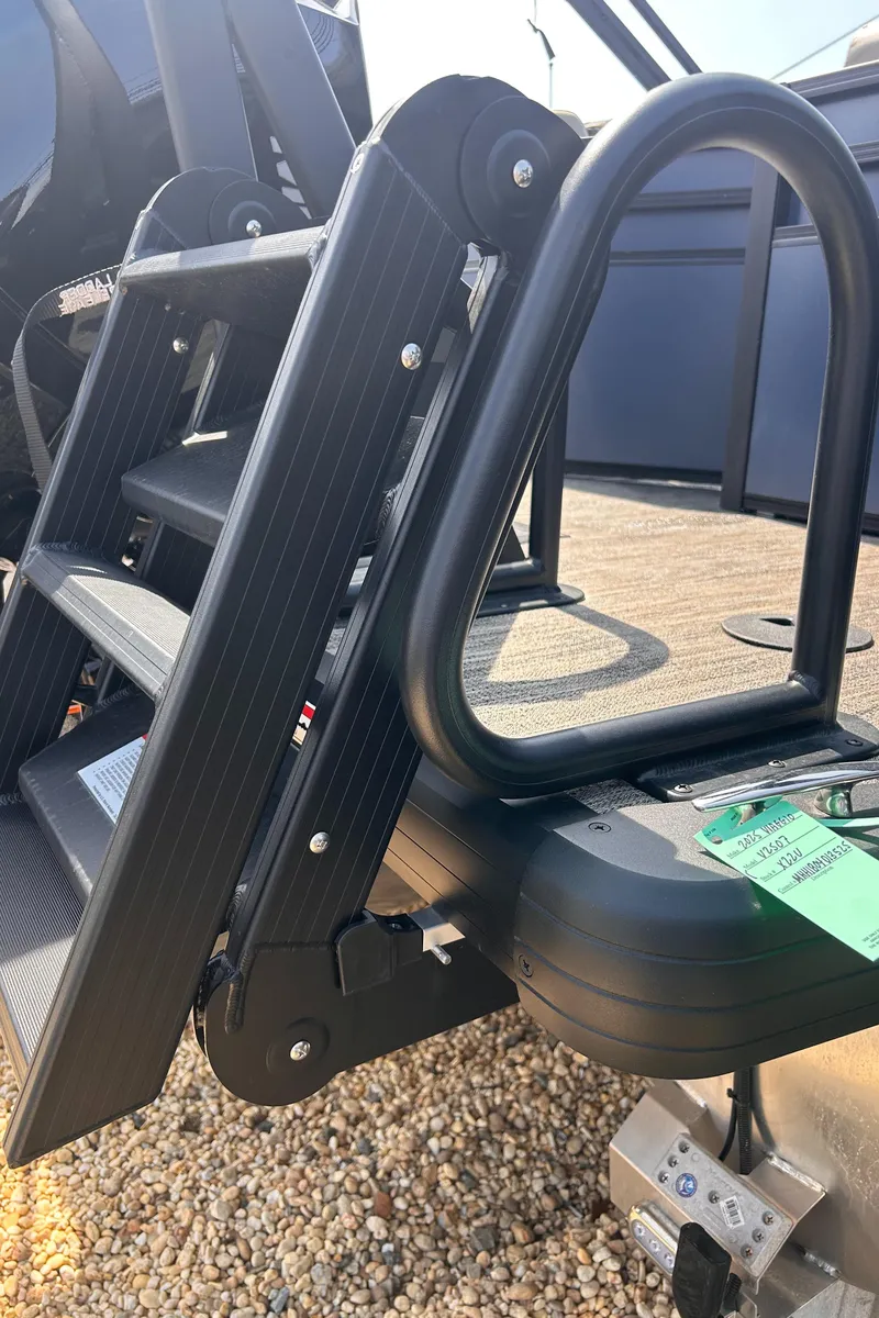 Slide: The Image of Folding ladder on 2025 Viaggio Lago X-U boat, resting on gravel surface. - 9