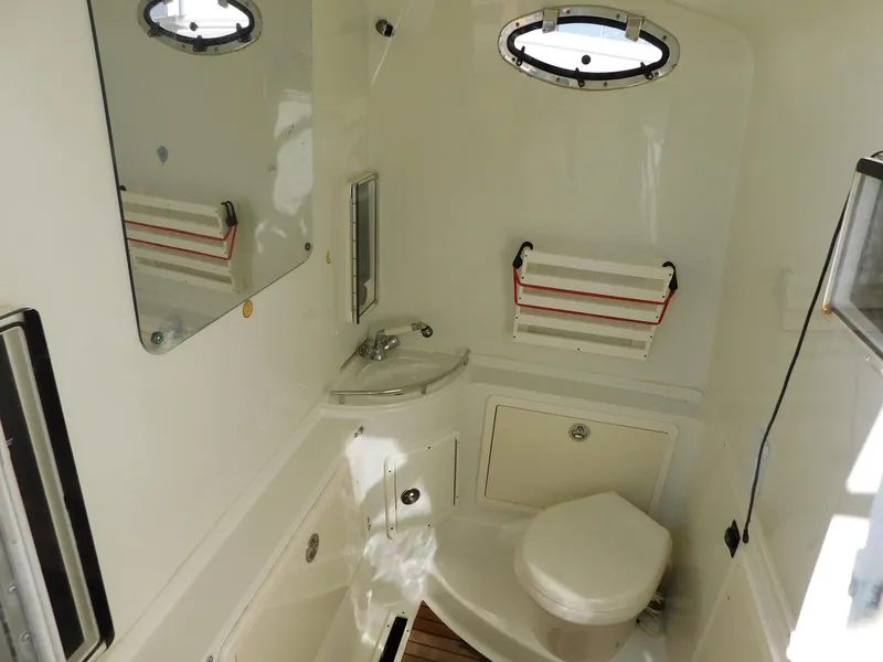 Slide: The Image of 2013 Hydra-Sports 4200 Siesta boat bathroom with sink, toilet, and mirror. - 11