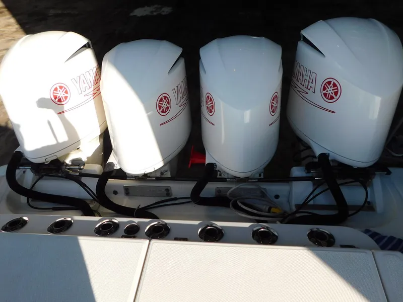 Slide: The Image of Four Yamaha outboard engines on a 2013 Hydra-Sports 4200 Siesta boat. - 14