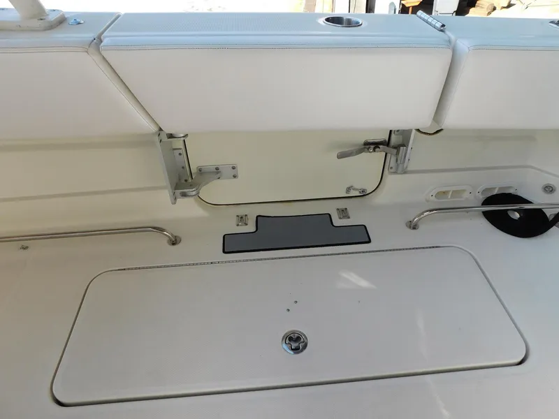 Slide: The Image of 2013 Hydra-Sports 4200 Siesta boat interior with storage compartment and seating. - 16