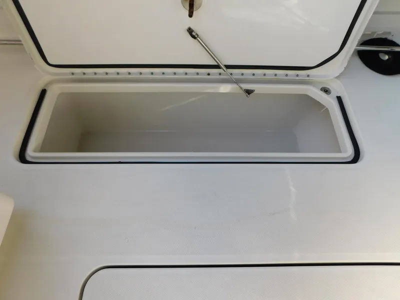 Slide: The Image of Open storage compartment on 2013 Hydra-Sports 4200 Siesta boat. - 17