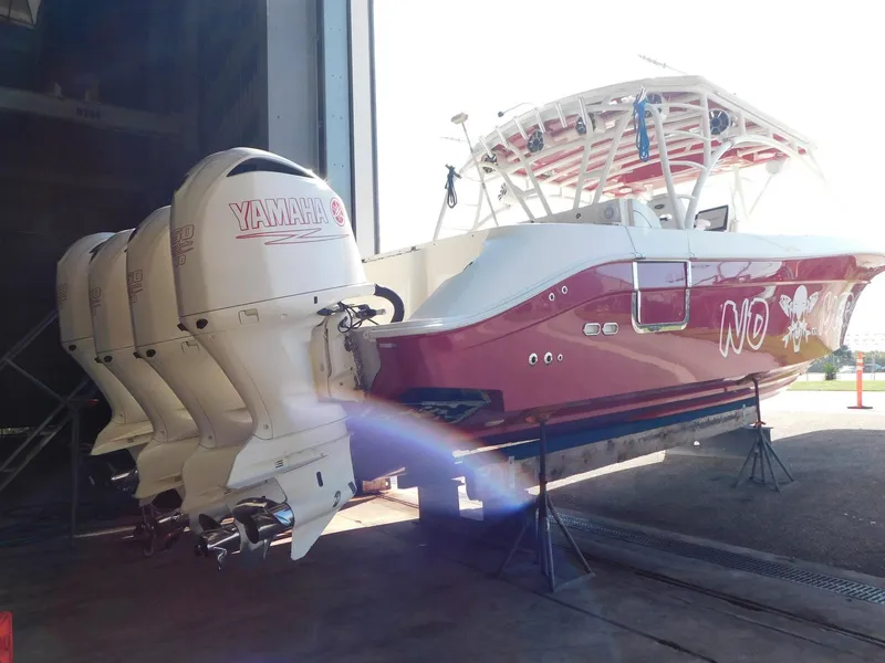 Slide: The Image of 2013 Hydra-Sports 4200 Siesta boat with Yamaha engines in a storage facility. - 22