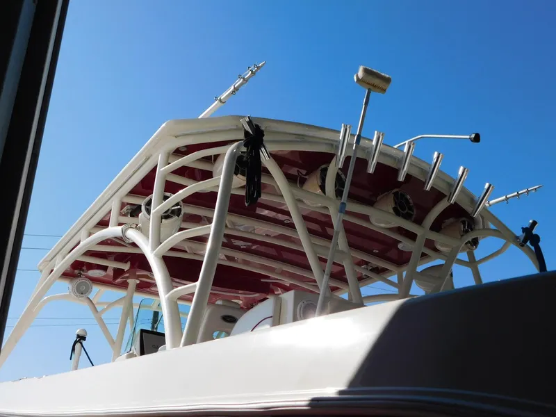 Slide: The Image of 2013 Hydra-Sports 4200 Siesta boat with radar and antennas against a clear blue sky. - 5