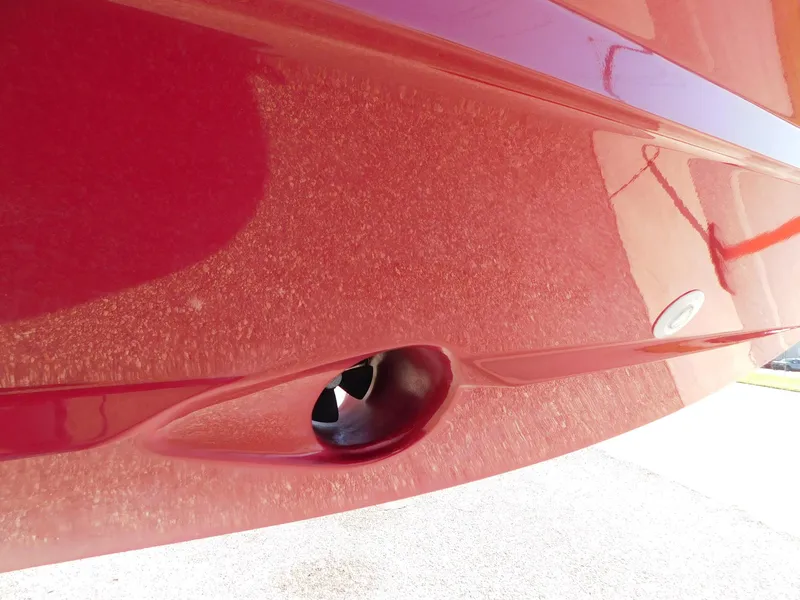 Slide: The Image of Close-up of a red 2013 Hydra-Sports 4200 Siesta boat hull detail. - 6