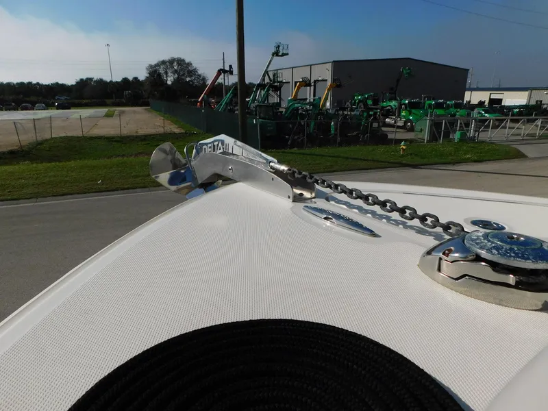 Slide: The Image of 2013 Hydra-Sports 4200 Siesta boat anchor and chain on deck, industrial background. - 7