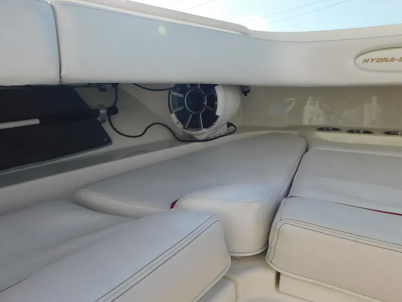 Slide: The Image of 2013 Hydra-Sports 4200 Siesta boat interior with white cushioned seating. - 8