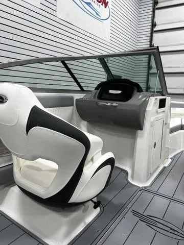 Slide: The Image of 2024 Chaparral 21 SSI Sport boat interior with sleek design and modern dashboard. - 10