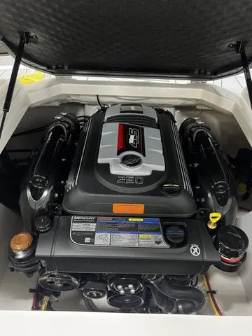 Slide: The Image of 2024 Chaparral 21 SSI Sport engine compartment showcasing powerful motor design. - 11