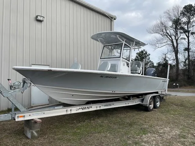 The Image of 2019 Sportsman Masters 267 Bay Boat docked on calm waters. - 0