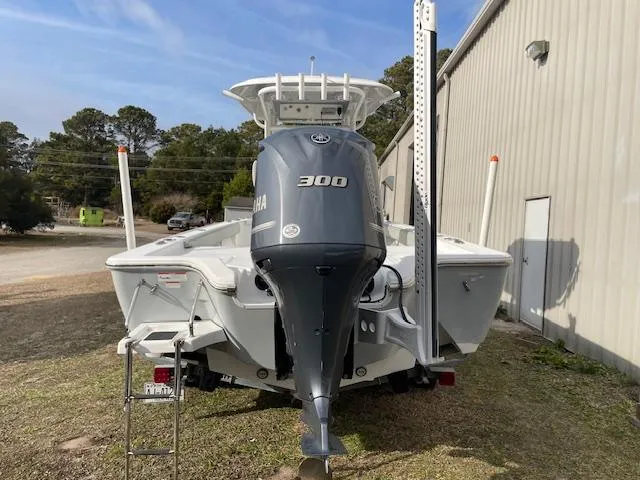 Slide: The Image of 2019 Sportsman Masters 267 Bay Boat docked on calm water. - 3