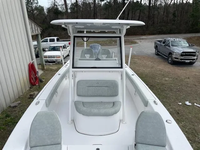 Slide: The Image of 2019 Sportsman Masters 267 Bay Boat on trailer by waterfront dock. - 5