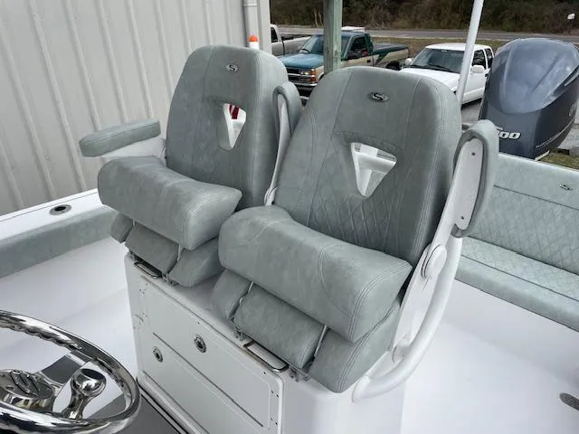 Slide: The Image of 2019 Sportsman 267 Masters boat dashboard with steering wheel and dual displays. - 7