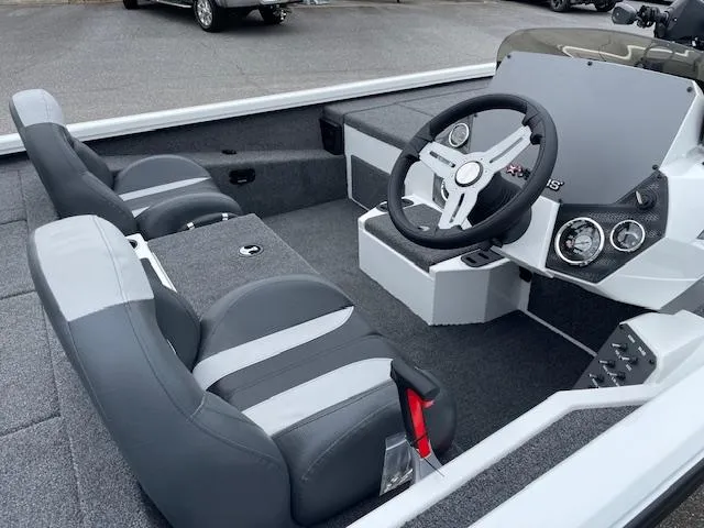 Slide: The Image of Interior of 2025 Vexus AVX V2 1880 boat with gray seating and modern dashboard. - 10