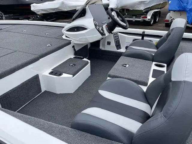 Slide: The Image of 2025 Vexus AVX V2 1880 boat interior with gray seating and modern dashboard. - 7