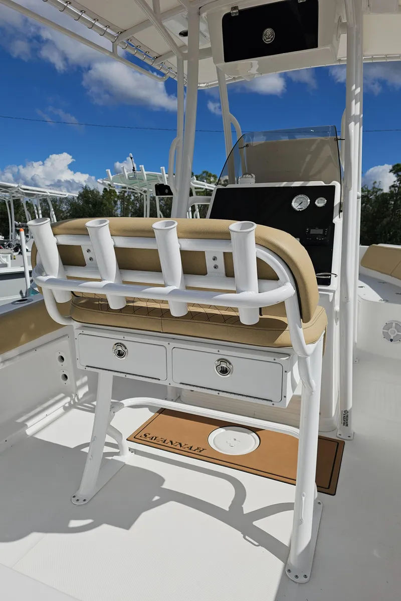 Slide: The Image of 2025 Savannah 2200 Offshore boat interior with rod holders and storage drawers. - 14