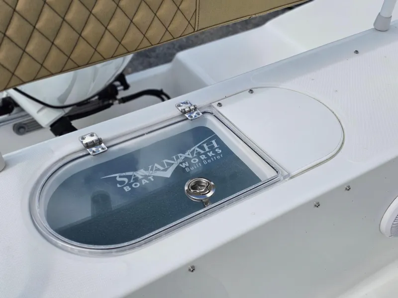 Slide: The Image of 2025 Savannah 2200 Offshore boat detail with logo on deck compartment. - 15