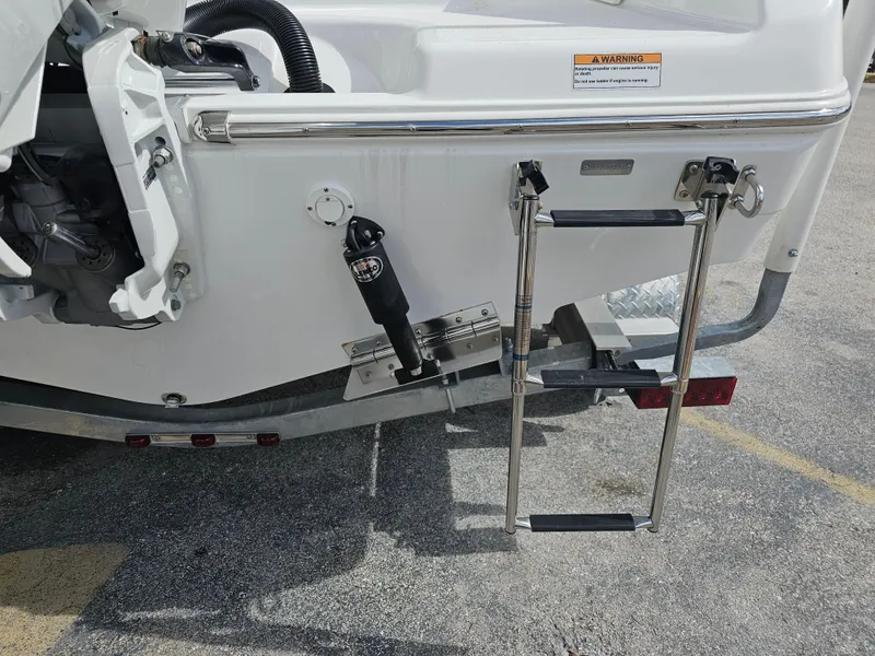 Slide: The Image of 2025 Savannah 2200 Offshore boat stern with ladder and motor mount. - 16