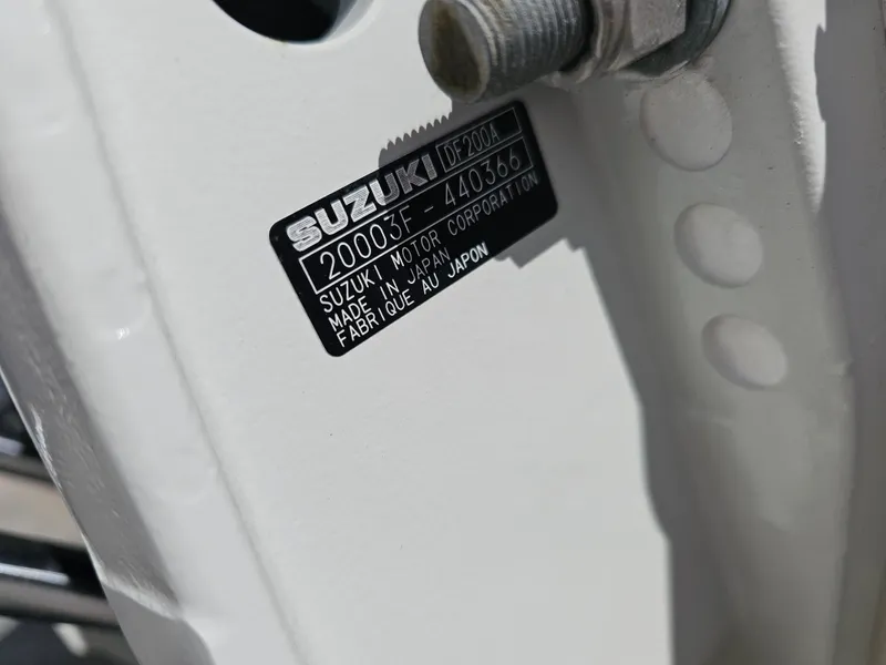 Slide: The Image of Label on a 2025 Savannah 2200 Offshore boat, featuring Suzuki motor details. - 19