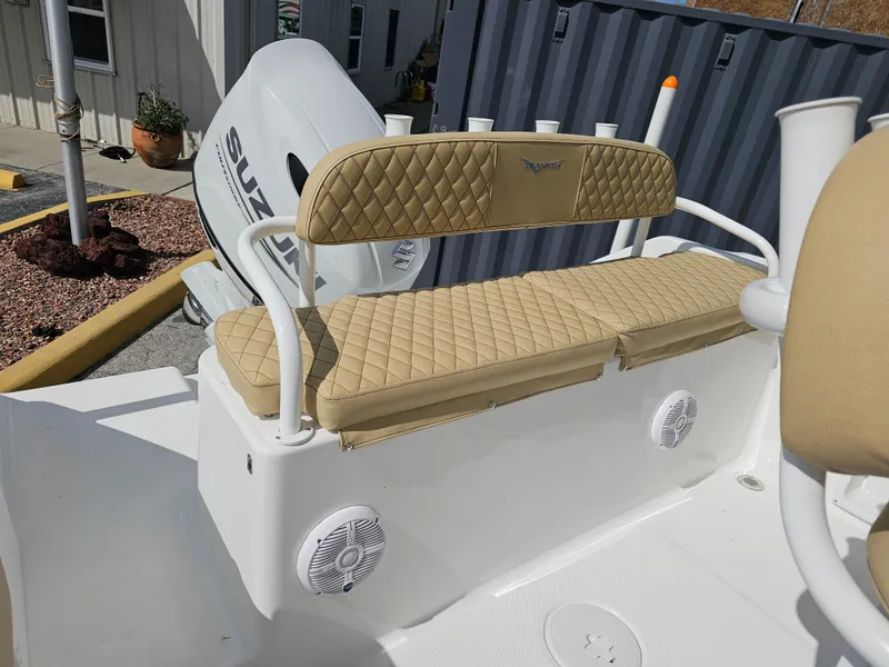 Slide: The Image of 2025 Savannah 2200 Offshore boat with beige seating and Suzuki outboard motor. - 26