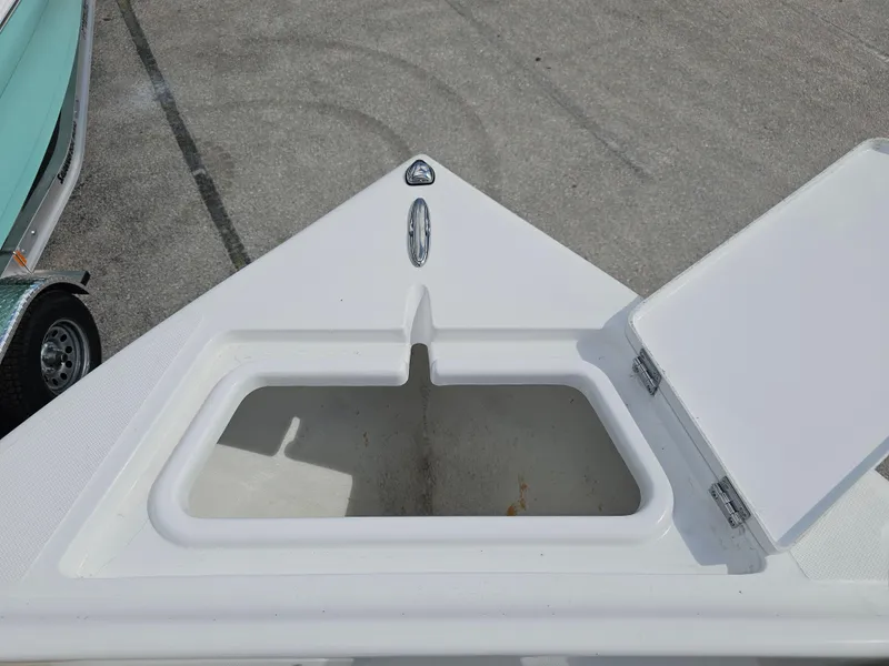 Slide: The Image of 2025 Savannah 2200 Offshore boat bow with open storage compartment. - 31