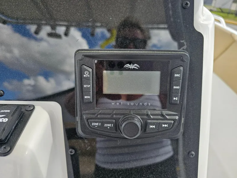 Slide: The Image of Control panel on 2025 Savannah 2200 Offshore boat, featuring audio system interface. - 32