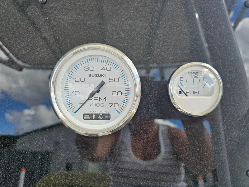 Slide: The Image of Close-up of Savannah 2200 Offshore 2025 boat gauges, showing RPM and fuel levels. - 33