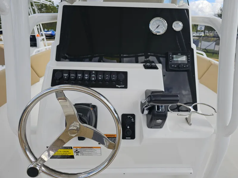Slide: The Image of Steering console of 2025 Savannah 2200 Offshore boat with controls and gauges. - 34