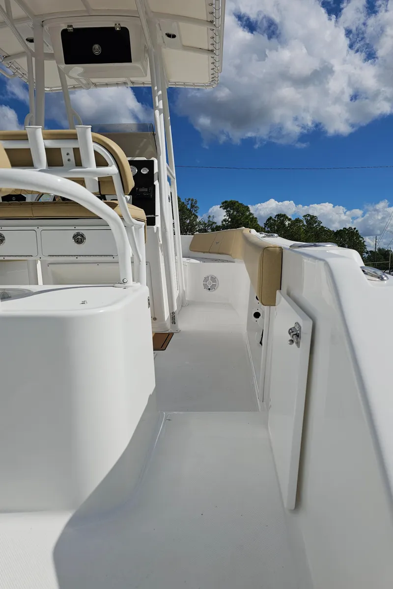 Slide: The Image of 2025 Savannah 2200 Offshore boat deck under a clear blue sky. - 36