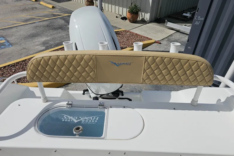 Slide: The Image of 2025 Savannah 2200 Offshore boat with tan quilted seating and rod holders. - 38