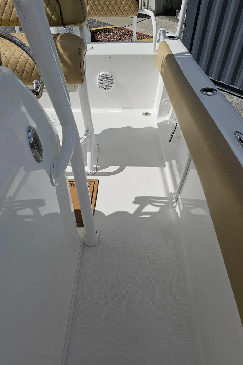 Slide: The Image of 2025 Savannah 2200 Offshore boat interior with beige seating and white deck. - 39