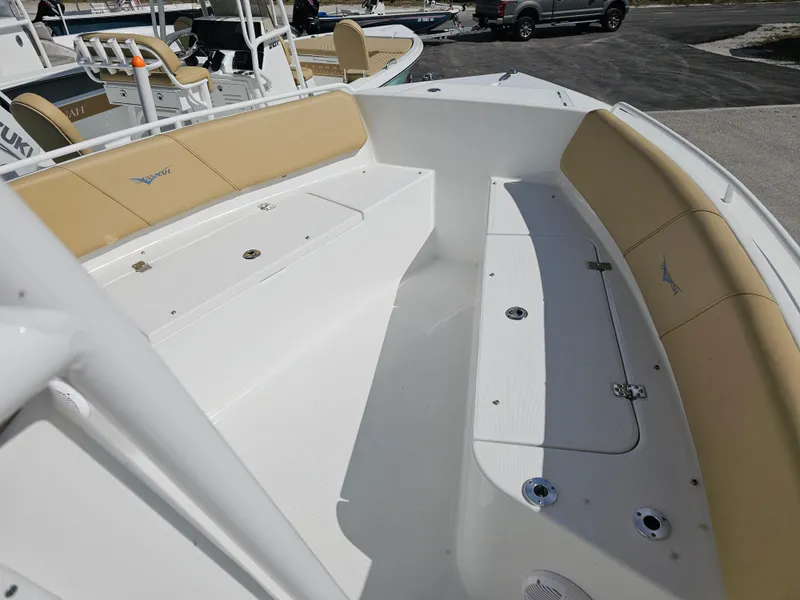 Slide: The Image of 2025 Savannah 2200 Offshore boat interior with beige seating and white deck. - 4