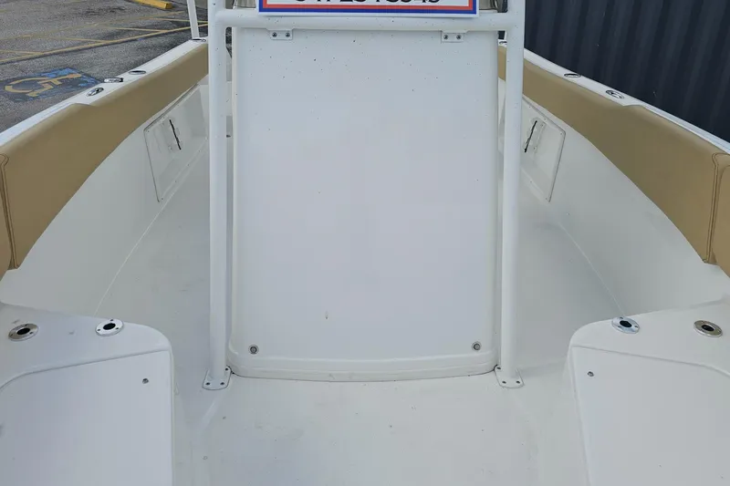 Slide: The Image of 2025 Savannah 2200 Offshore boat interior with beige seating and white deck. - 47