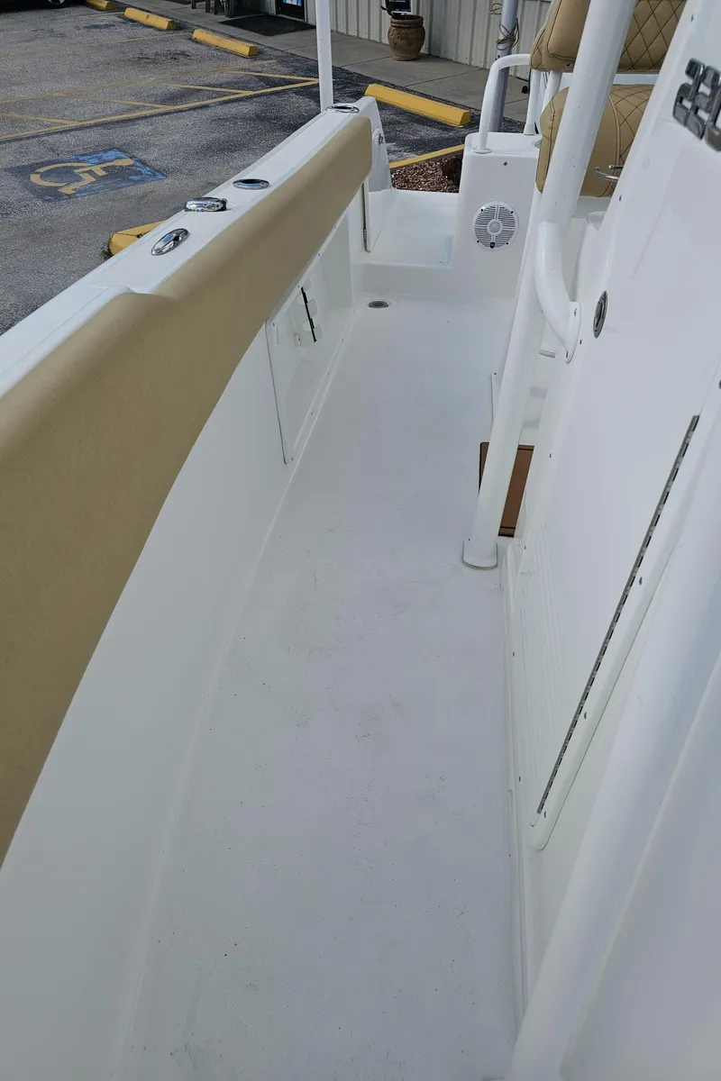 Slide: The Image of 2025 Savannah 2200 Offshore boat deck with beige seating and white interior. - 48