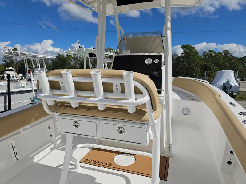 Slide: The Image of 2025 Savannah 2200 Offshore boat interior with rod holders and storage drawers. - 5