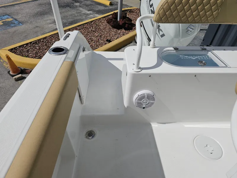 Slide: The Image of 2025 Savannah 2200 Offshore boat interior with beige seating and speaker. - 7