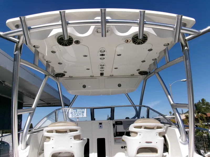 Slide: The Image of 2016 Sea Fox 256 Voyager boat interior with dual seats and overhead speakers. - 15