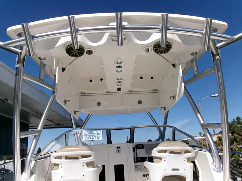 Slide: The Image of 2016 Sea Fox 256 Voyager boat interior with seating and overhead console. - 16