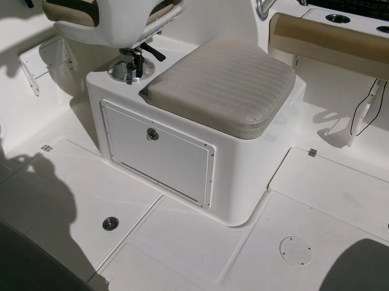 Slide: The Image of 2016 Sea Fox 256 Voyager boat interior with seating and storage compartment. - 18