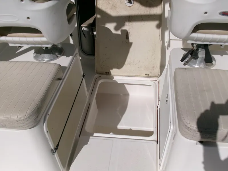 Slide: The Image of 2016 Sea Fox 256 Voyager boat interior with storage compartment and seating. - 20