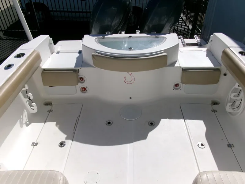 Slide: The Image of 2016 Sea Fox 256 Voyager boat deck with seating and storage compartments. - 22