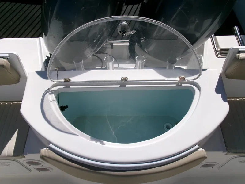 Slide: The Image of Livewell on 2016 Sea Fox 256 Voyager boat, featuring a clear lid and cup holders. - 24