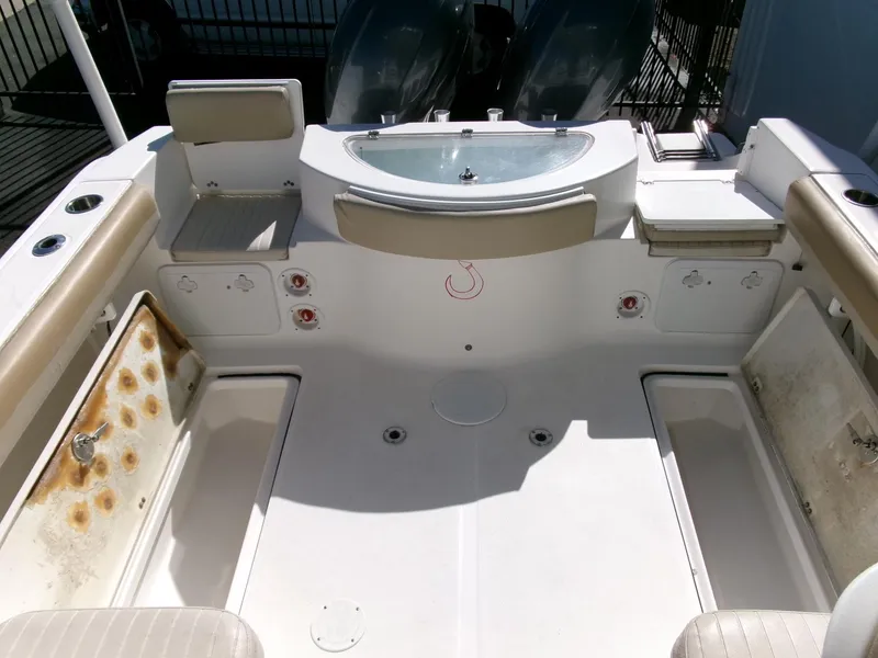 Slide: The Image of 2016 Sea Fox 256 Voyager boat interior with seating and storage compartments. - 25