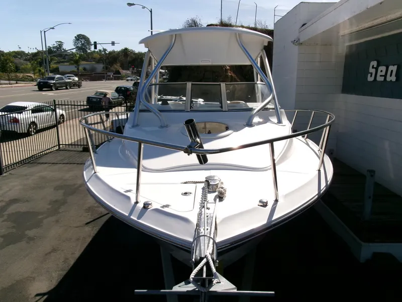 Slide: The Image of 2016 Sea Fox 256 Voyager boat displayed outdoors, front view. - 27
