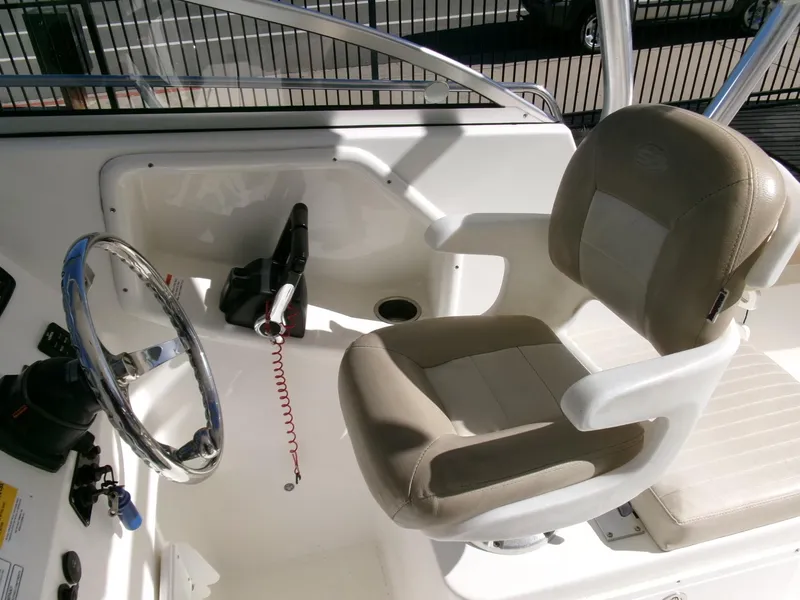 Slide: The Image of 2016 Sea Fox 256 Voyager helm with steering wheel and captain's chair. - 8