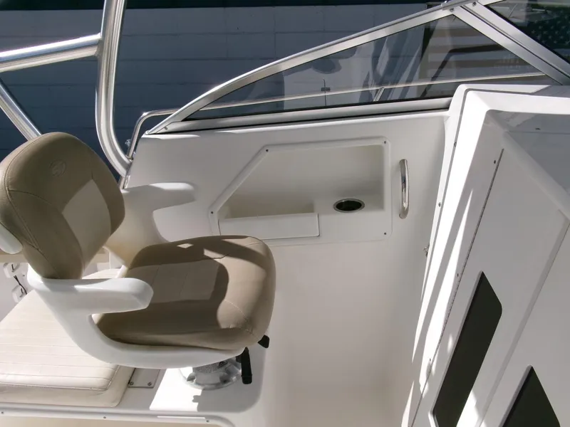 Slide: The Image of 2016 Sea Fox 256 Voyager boat interior with captain's chair and control panel. - 9