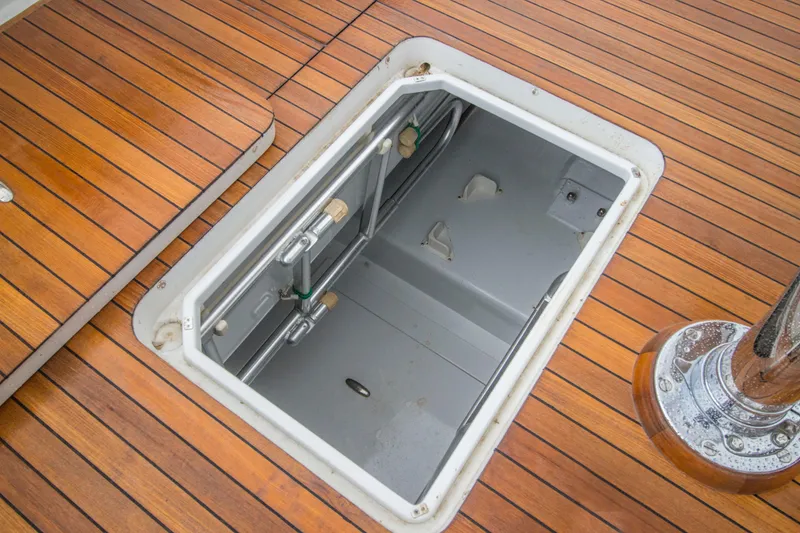 Slide: The Image of Open hatch on Merritt 80' Sportfish yacht, showcasing teak deck, 2000 model. - 15